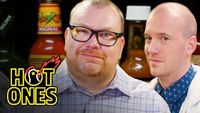 Superfan Brett Baker Grills Sean Evans Over Spicy Wings