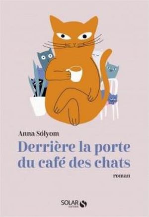 Derrière la porte du café des chats