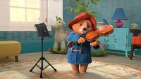 Paddington apprend le violon